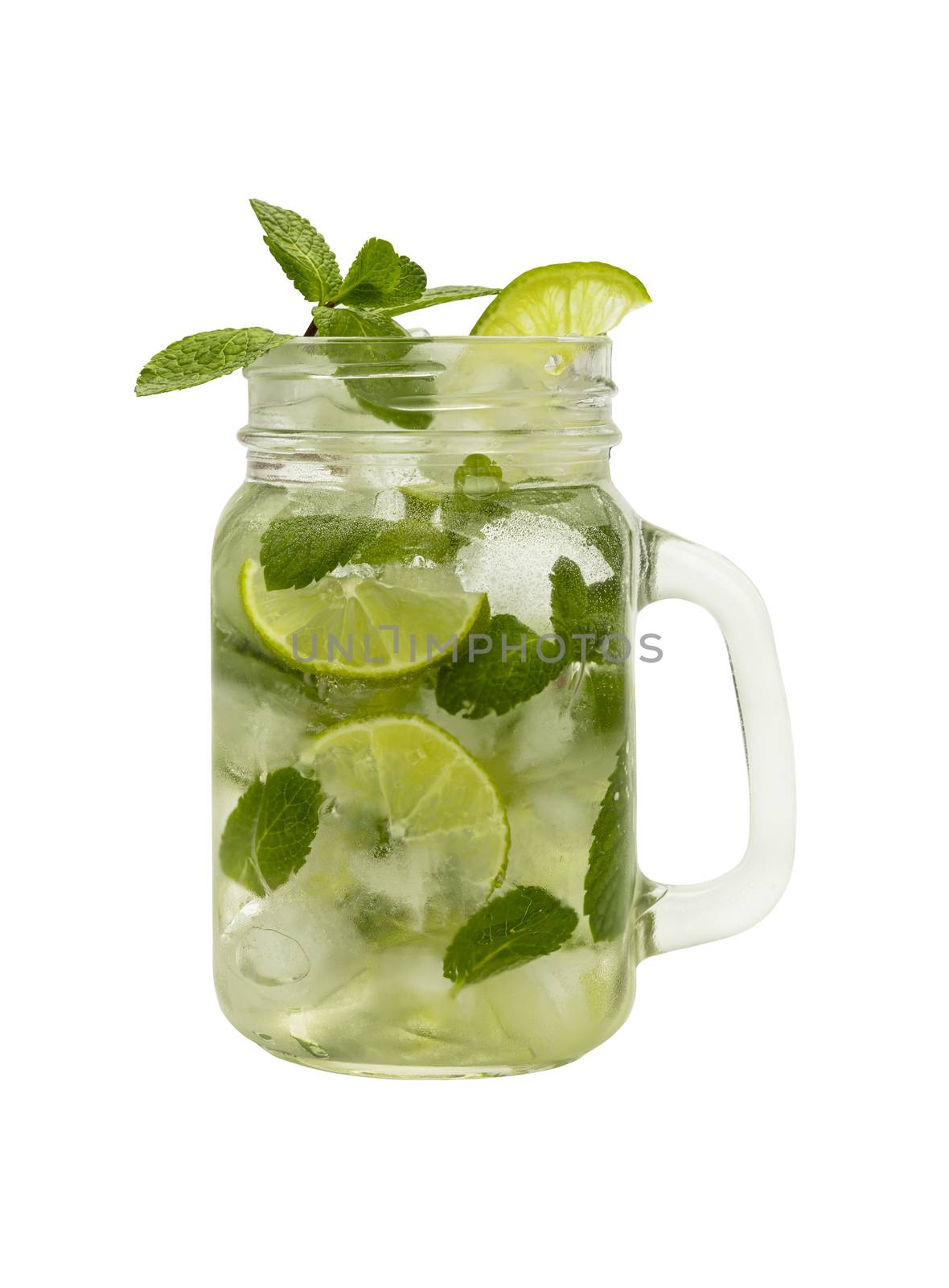 Close up one full big mason jar glass of mojito cocktail with mint leaves, lime slices and ice cubes, isolated on white background, low angle side view