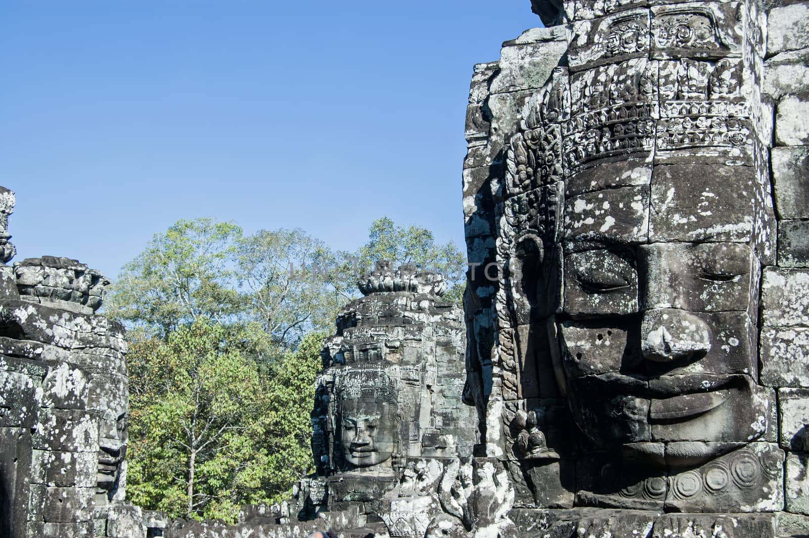 Faces at Bayon Temple by BasPhoto