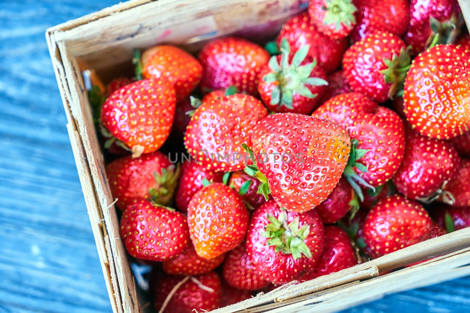 Strawberries in a wicker basket during spring in Poland