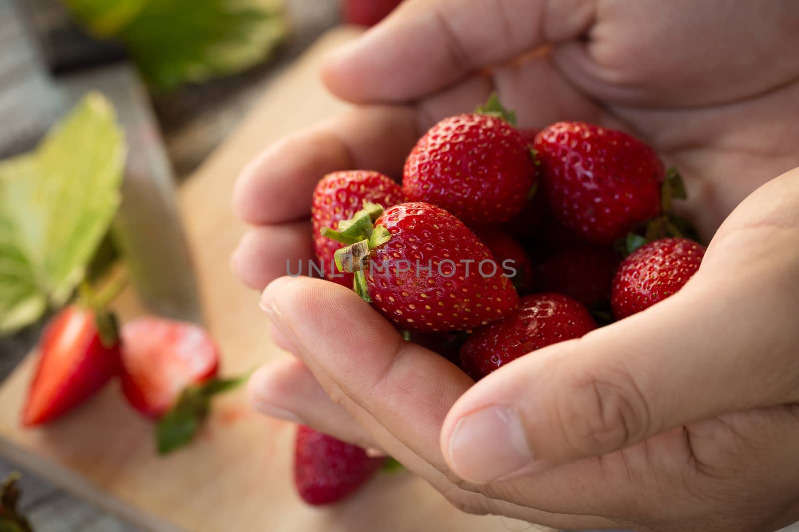 Strawberry In a bowl On a Wooden Background by kaiskynet