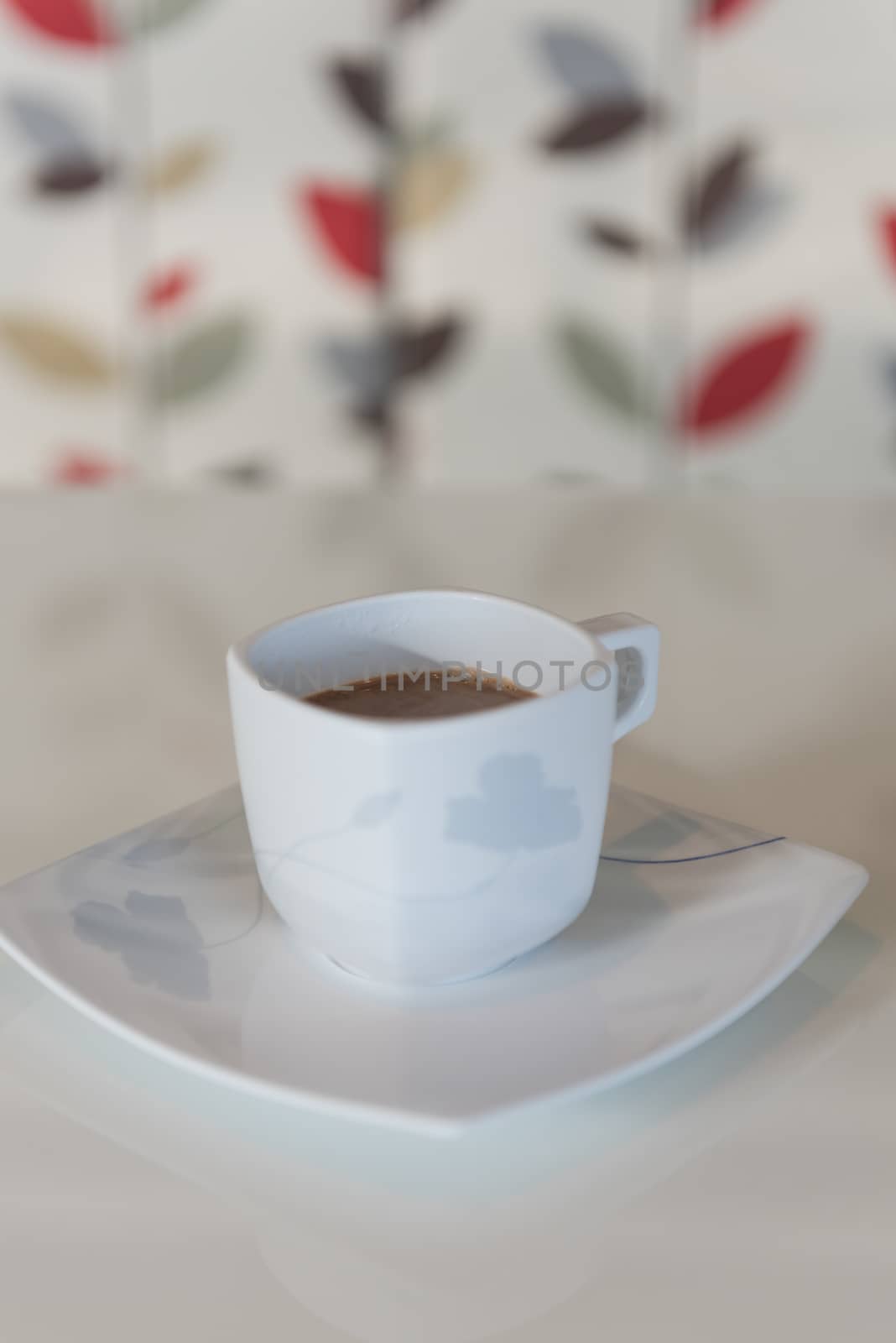 Morning coffee cup on white table
