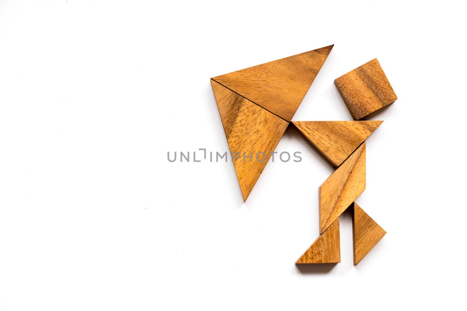 Wooden tangram as man hold umbrella shape on white background (Concept as business has the crisis)