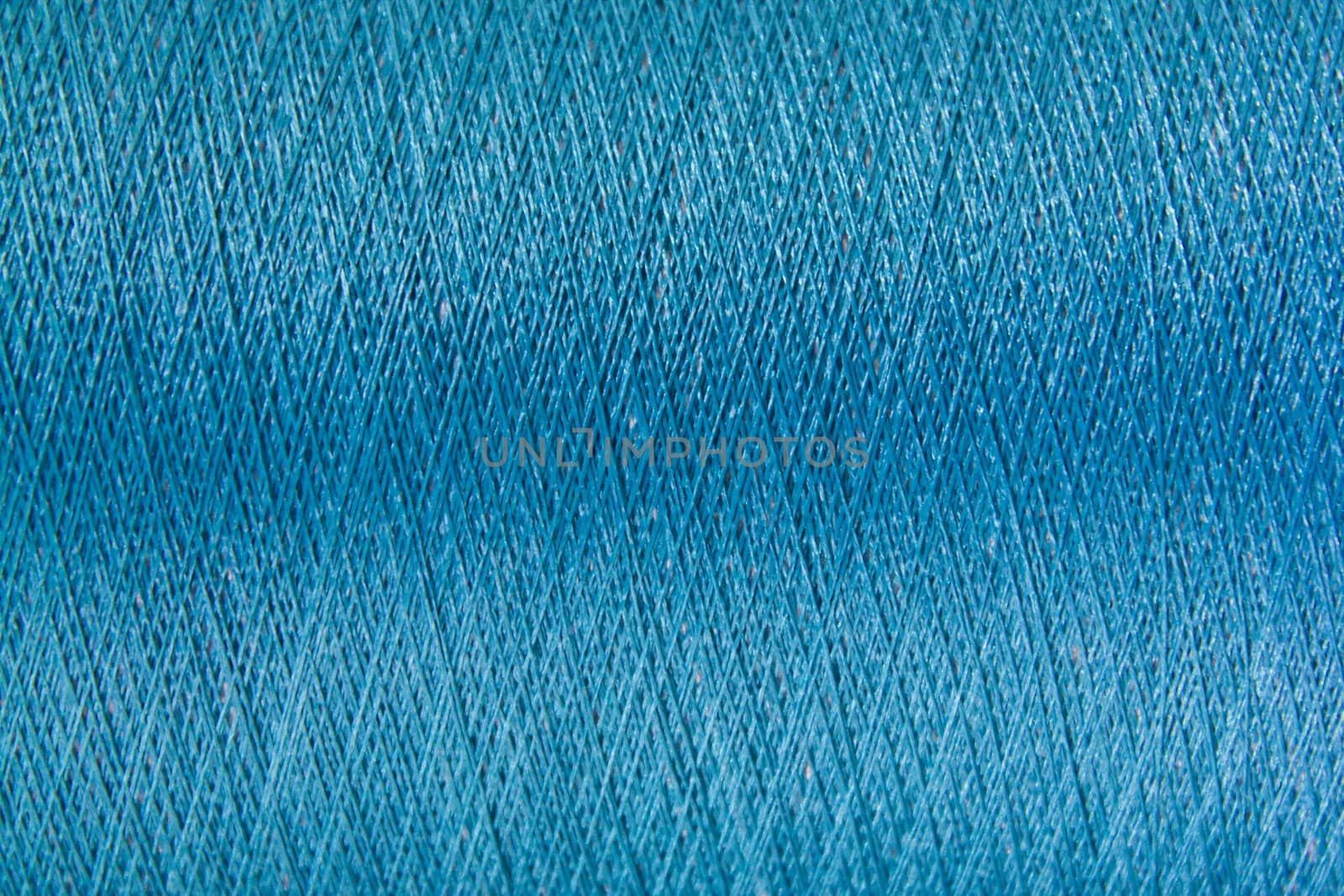 Closed up of blue color thread texture background by Hengpattanapong