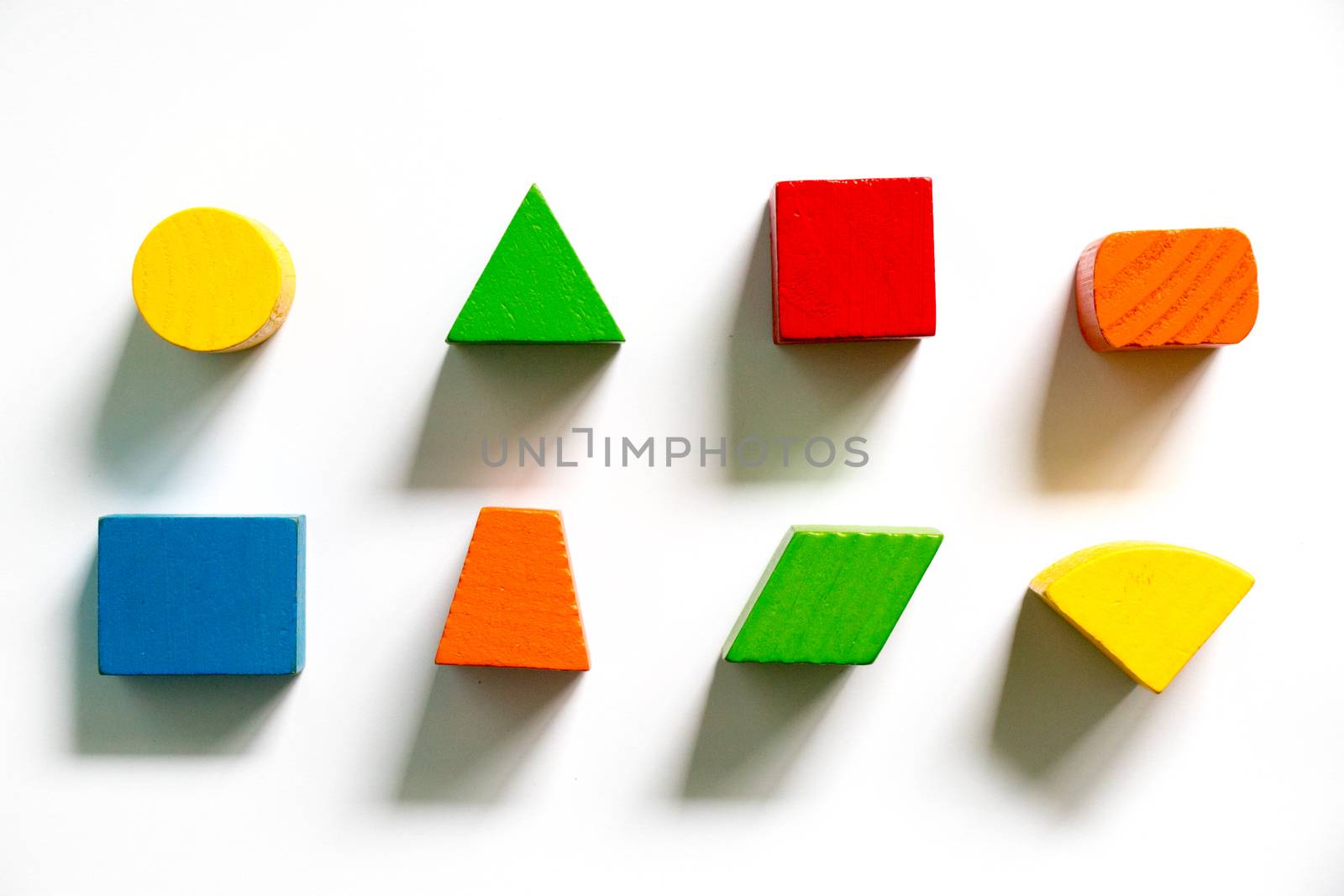 Set of colorful wooden shape toy on white background by Hengpattanapong