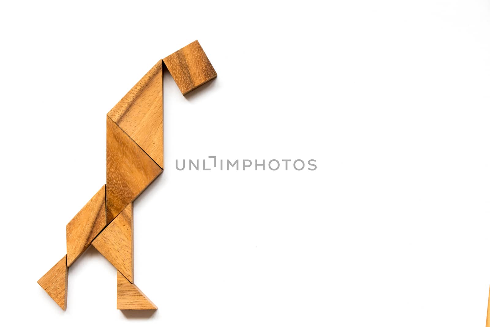Wooden tangram as anxiety man shape on white background (Concept as business has the crisis, man depress with the problem)