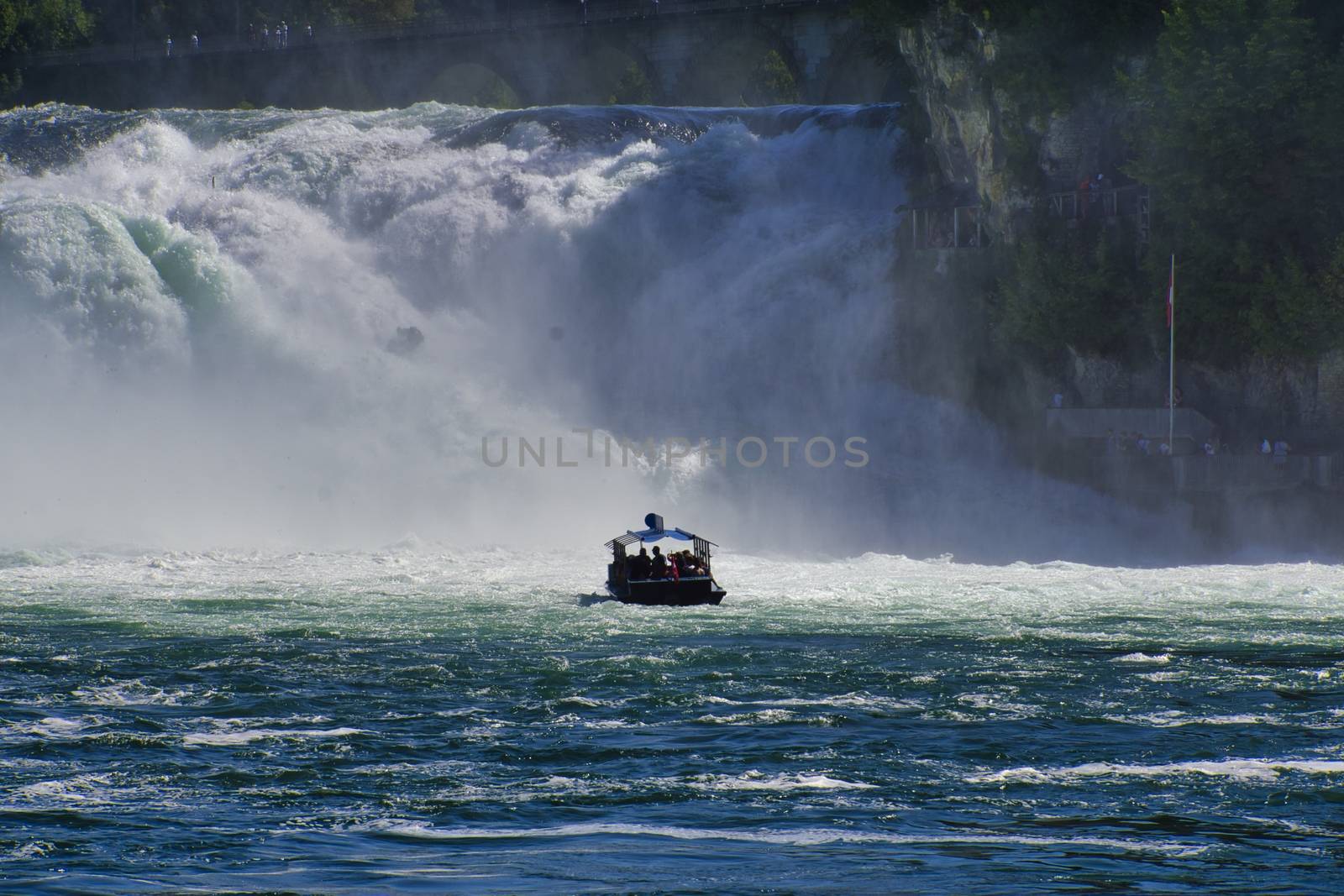 the famous rhine falls in the swiss near the city of Schaffhausen - sunny day and blue sky