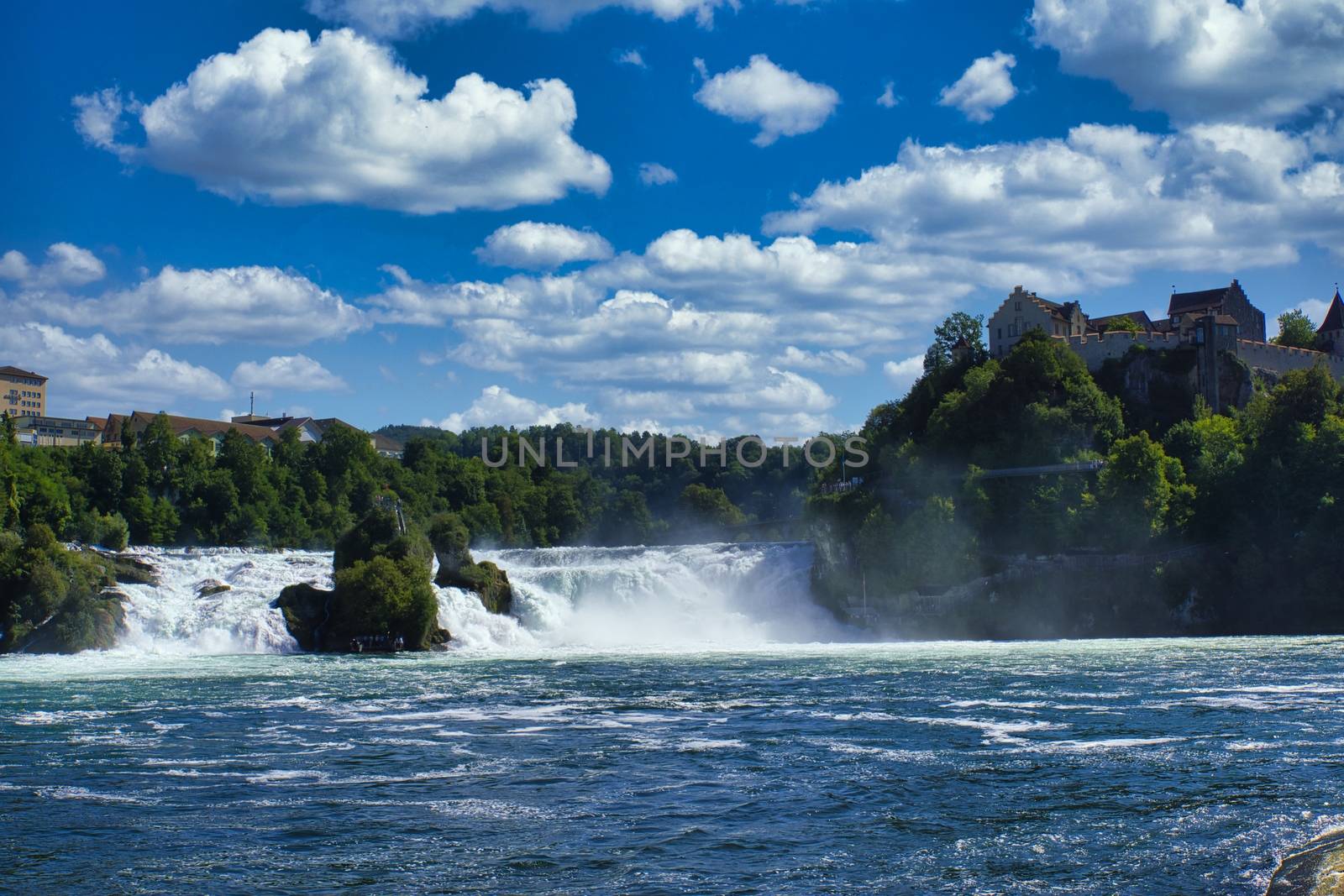 the famous rhine falls in the swiss near the city of Schaffhausen - sunny day and blue sky