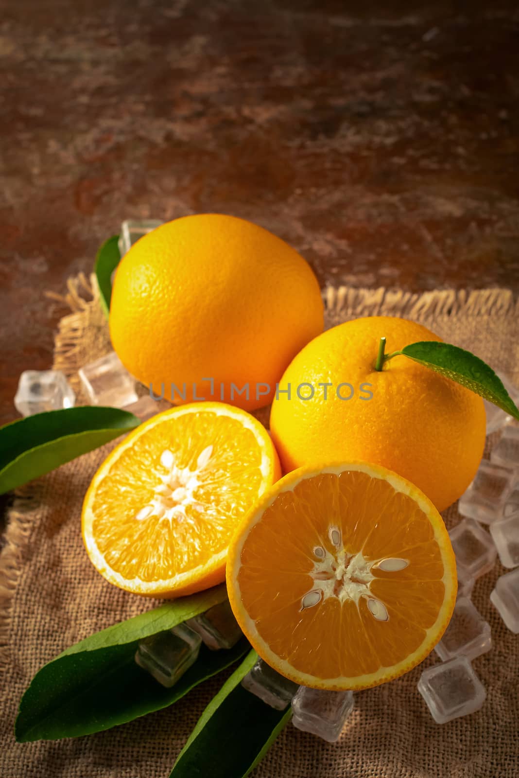 Fresh orange on a wooden table background.