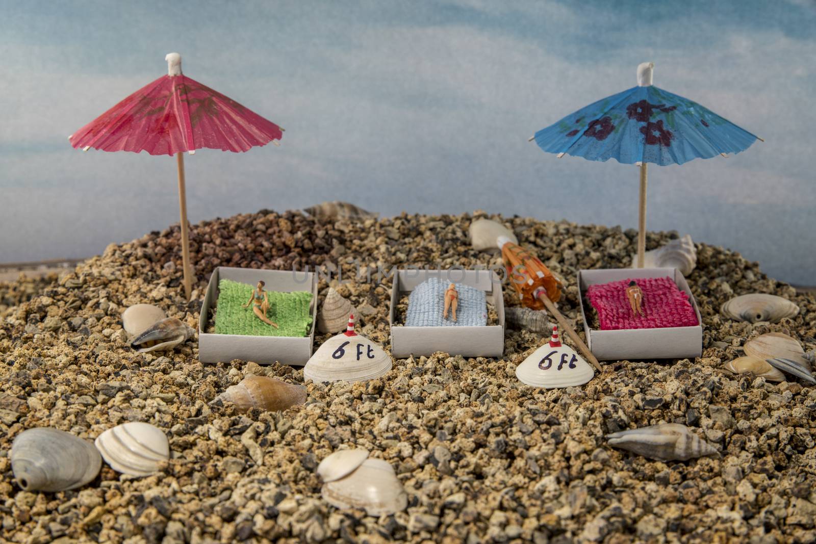 little figures to the beach with 6 feet distance because of the corona rules social distance