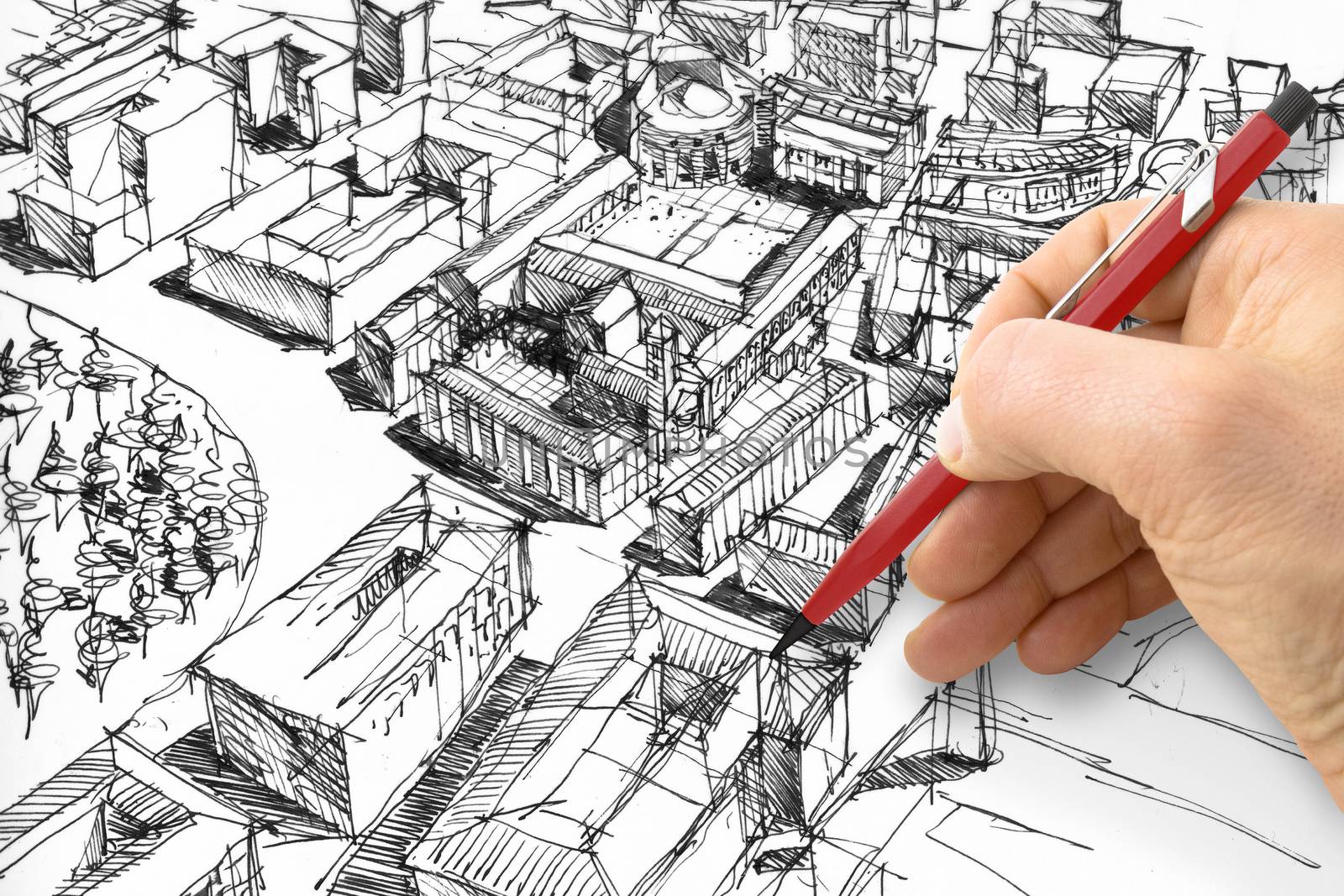 Planning a new city - Engineer-architect drawing with a pencil a sketch of a new modern imaginary town - concept image.