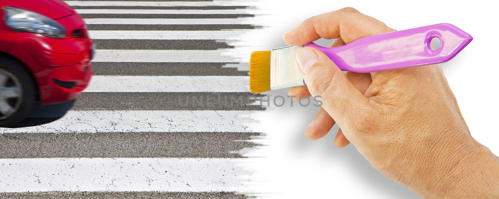 Black and white pedestrian crossing with red car on background - concept image with hand and brush - the car's shape has been modified and is not recognizable.