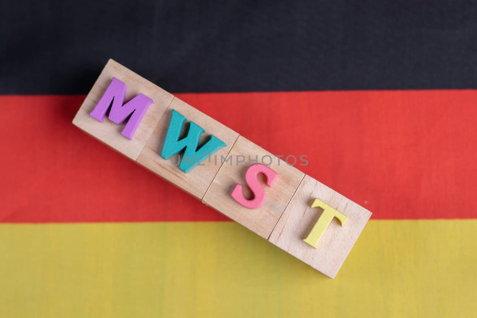 MWST or German Value Added Tax on german flag.