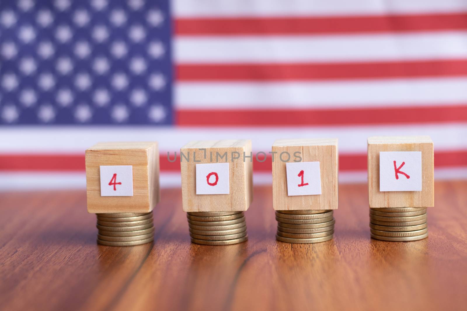 Concept of 401k retirement plan savings showing with US or american flag as background by lakshmiprasad.maski@gmai.com