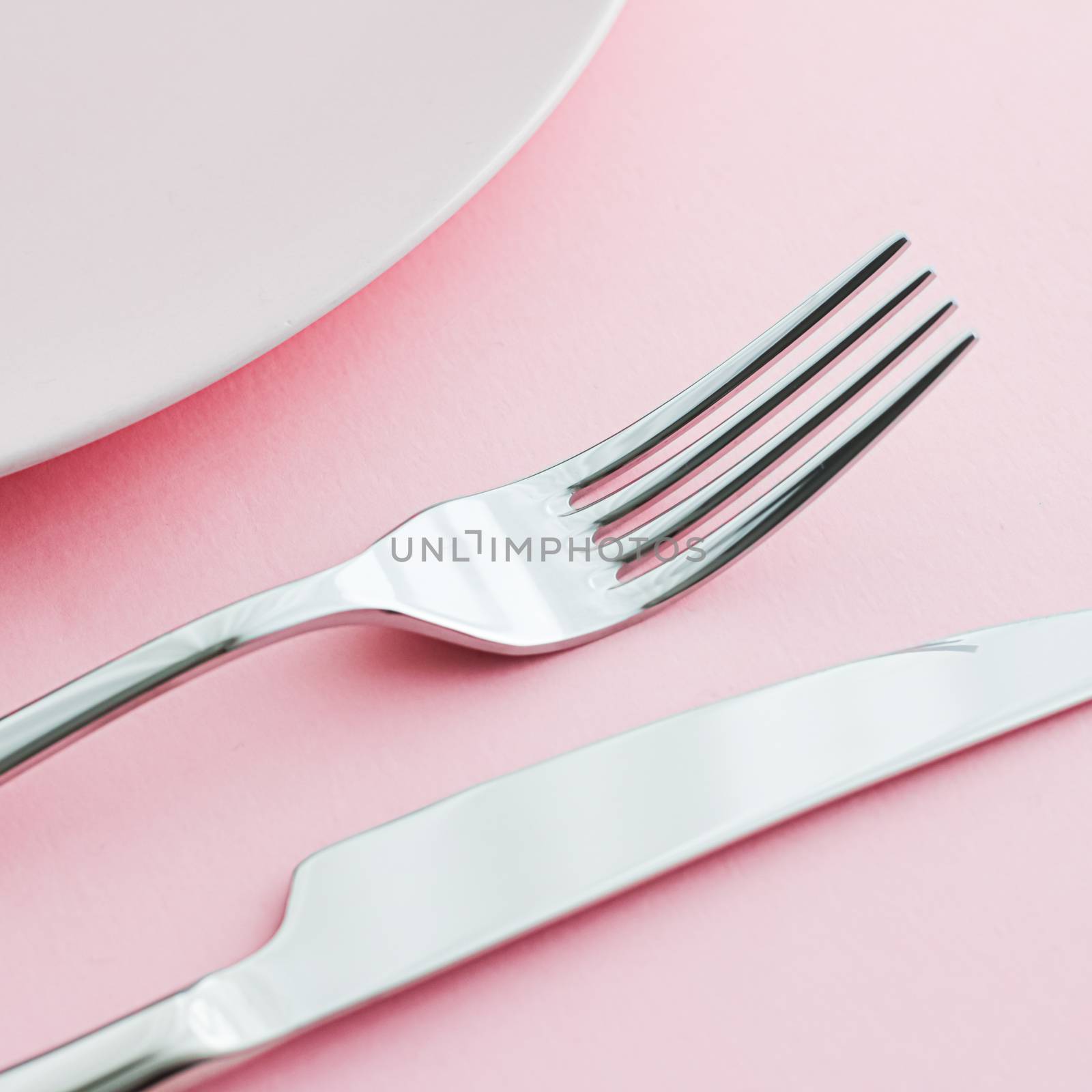 Empty plate and cutlery as mockup set on pink background, top tableware for chef table decor and menu branding by Anneleven