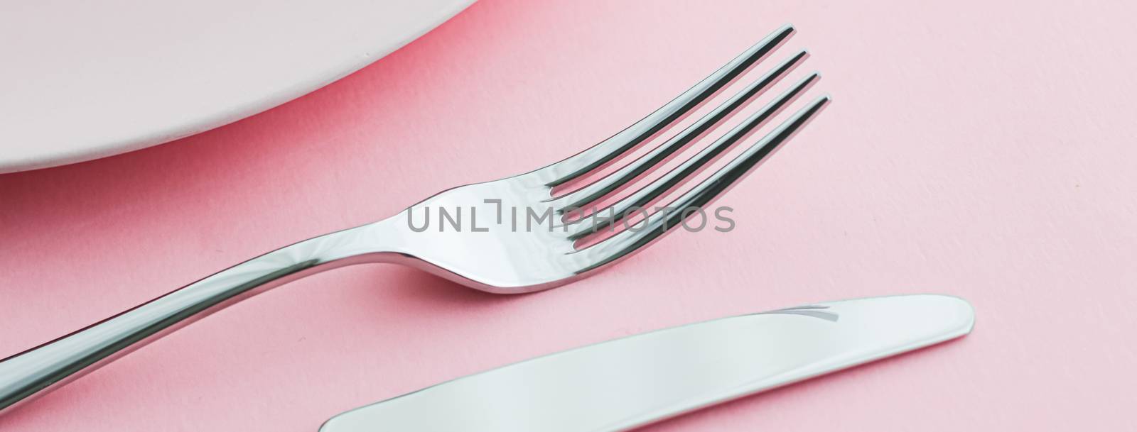 Empty plate and cutlery as mockup set on pink background, top tableware for chef table decor and menu branding by Anneleven