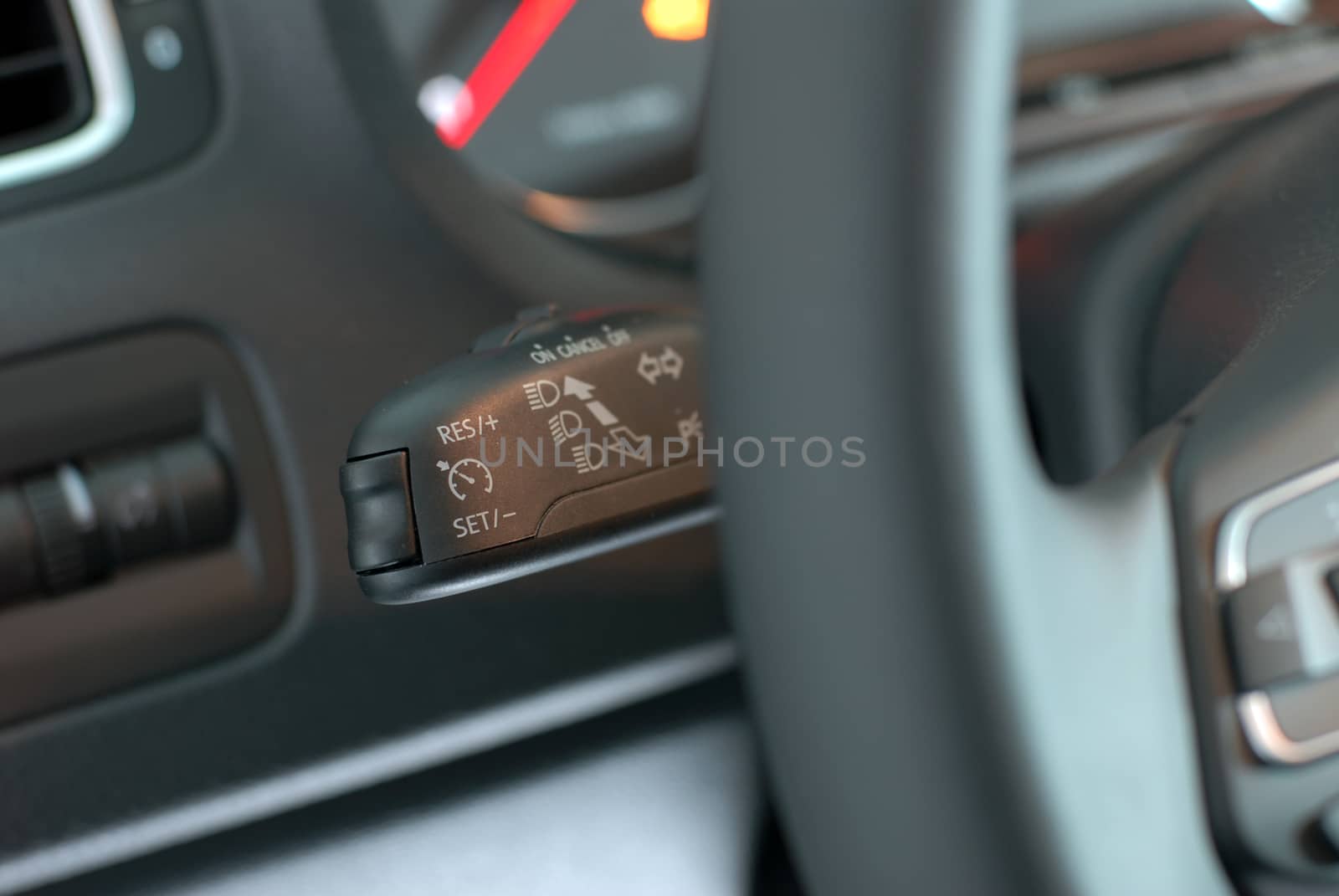 cruise control stick which is located behind the wheel