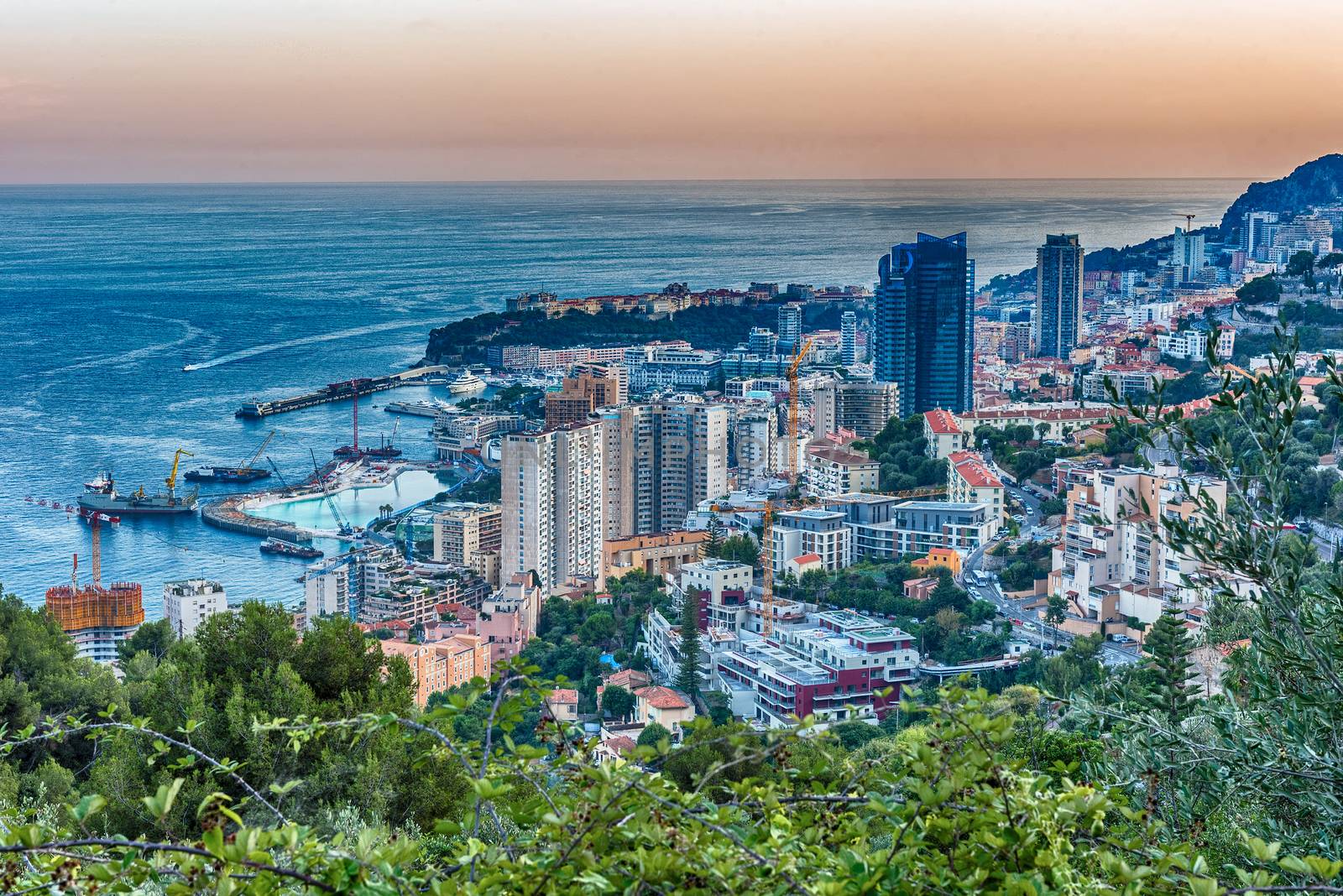 Panoramic view of Monaco at sunset from the Grande Corniche road, iconic landmark in Cote d'Azur, French Riviera