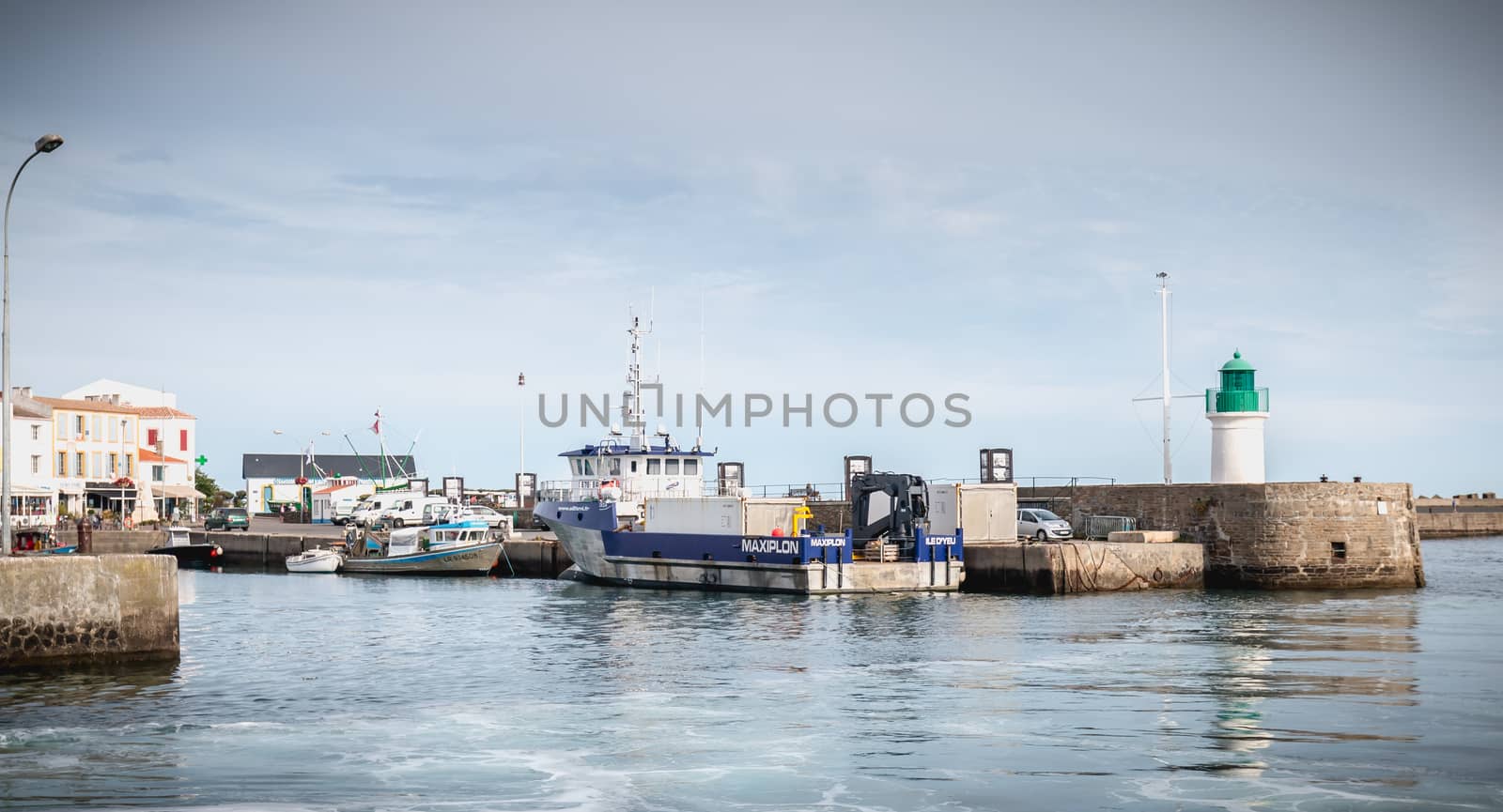 Port Joinville on the island of Yeu - September 17, 2018: view of the small port where maneuver fishing boats, tourism boats and sea shuttles going to the mainland on a summer day