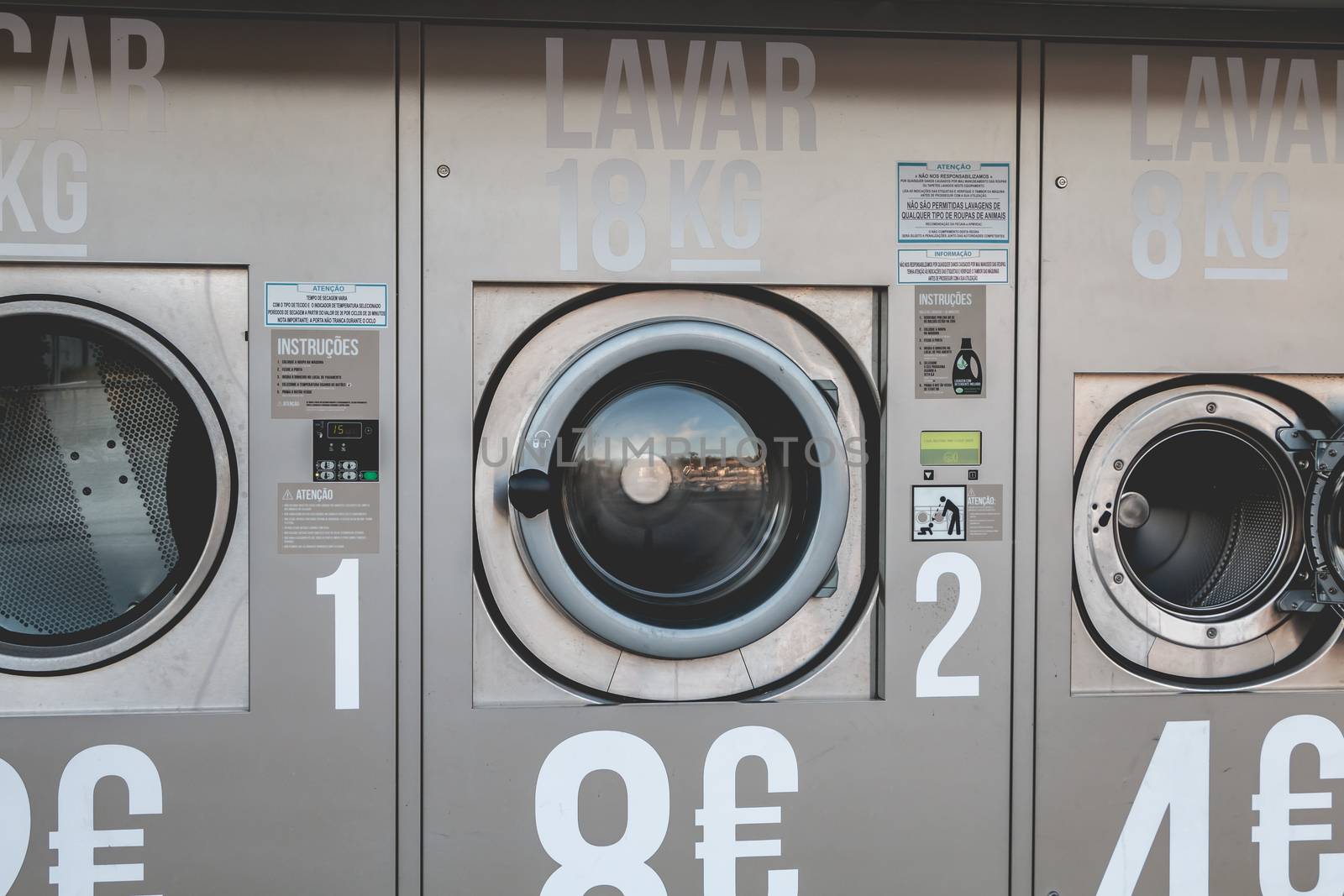 View of an automatic public washing machine in Albufeira, Portug by AtlanticEUROSTOXX