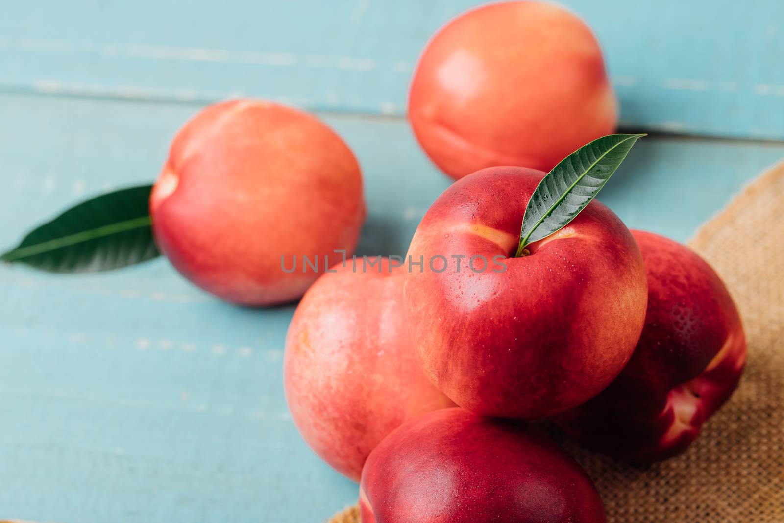 Sweet nectarine on wooden background by freedomnaruk