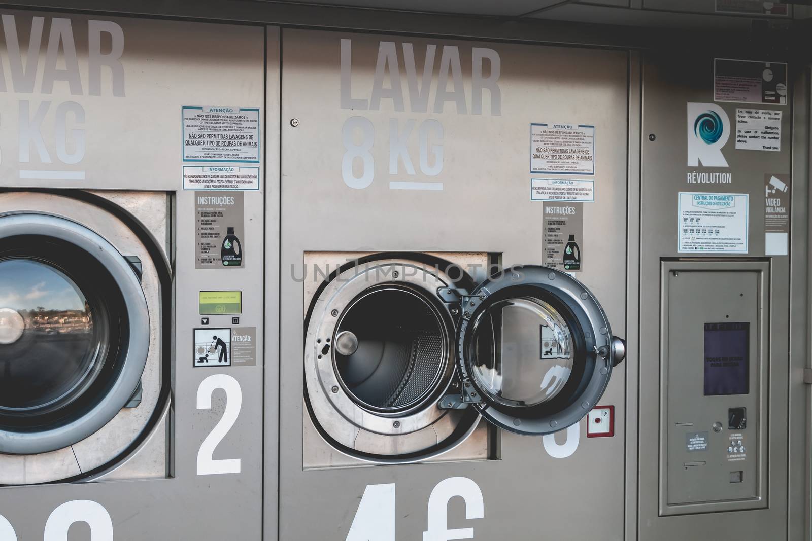 Albufeira, Portugal - May 3, 2018 - View of an automatic public washing machine in the city center on a spring day