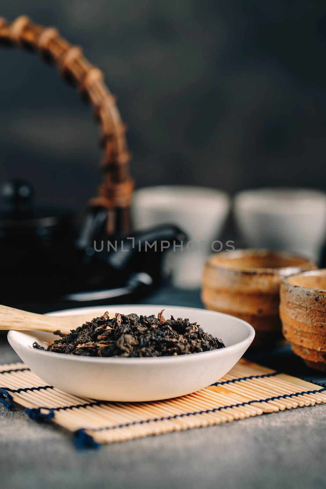 Hot tea in glass teapot and cup with steam