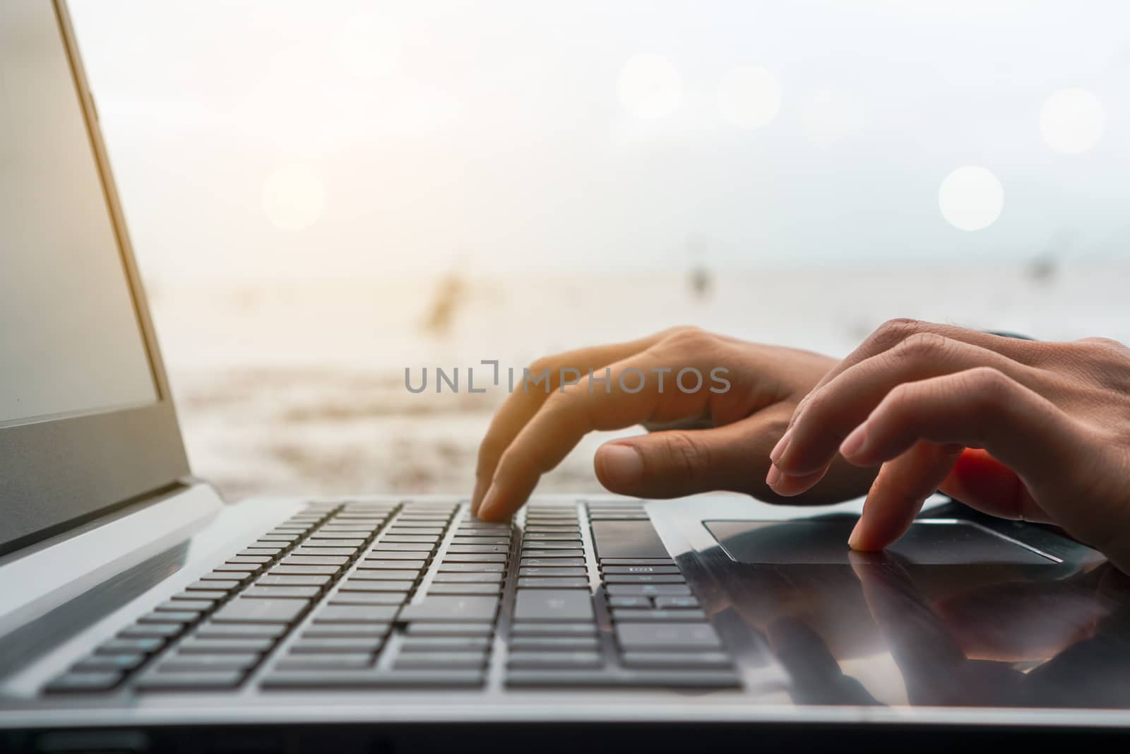 Woman hand using laptop to work study on work desk with clean nature background background. Business, financial, trade stock maket and social network. by Suwant