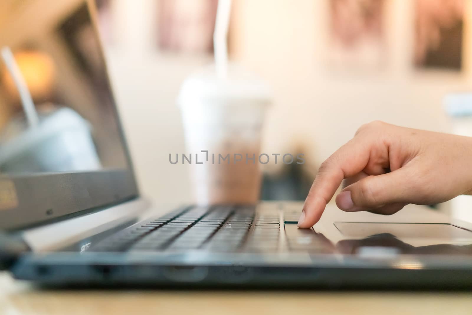 Woman hand using laptop to work study on work desk with clean nature background background. Business, financial, trade stock maket and social network. by Suwant