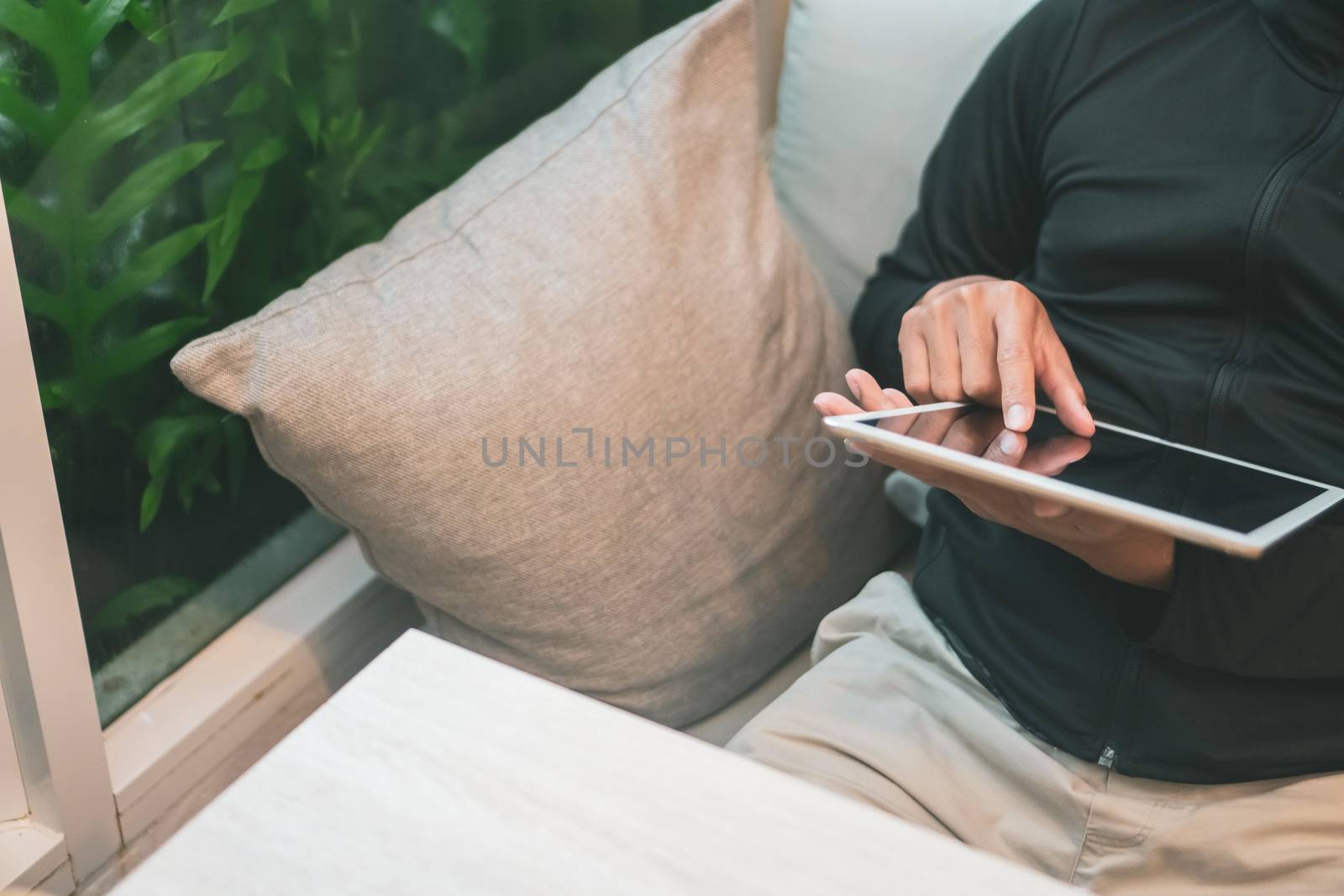 Woman hand use smartphone to do work business, social network, communication in public cafe work space area.