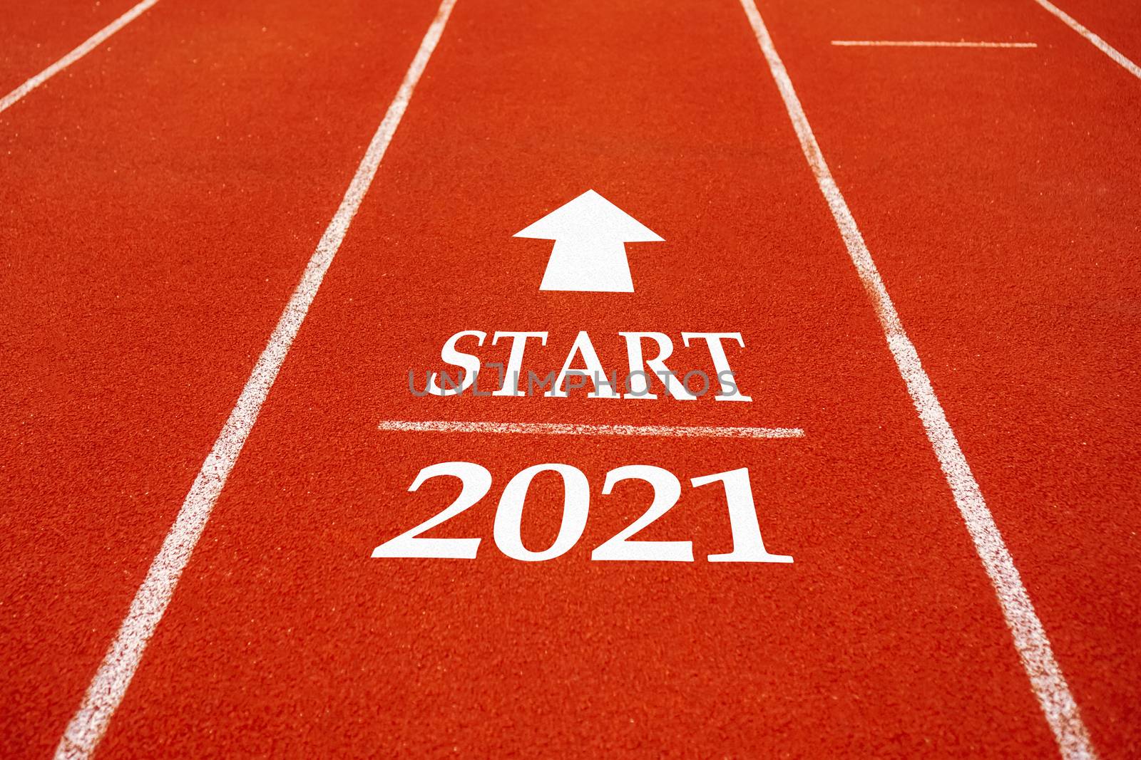 Start line to 2021 on running court represents the beginning of a journey to the destination in business planning, strategy and challenge or career path, opportunity concept.