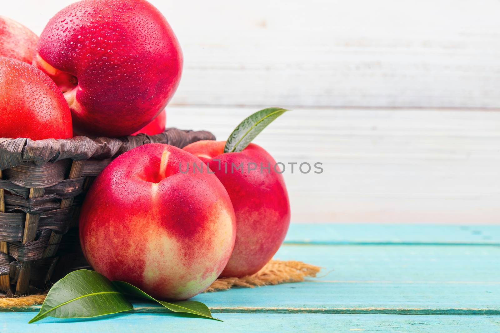 Sweet nectarine on wooden background by freedomnaruk