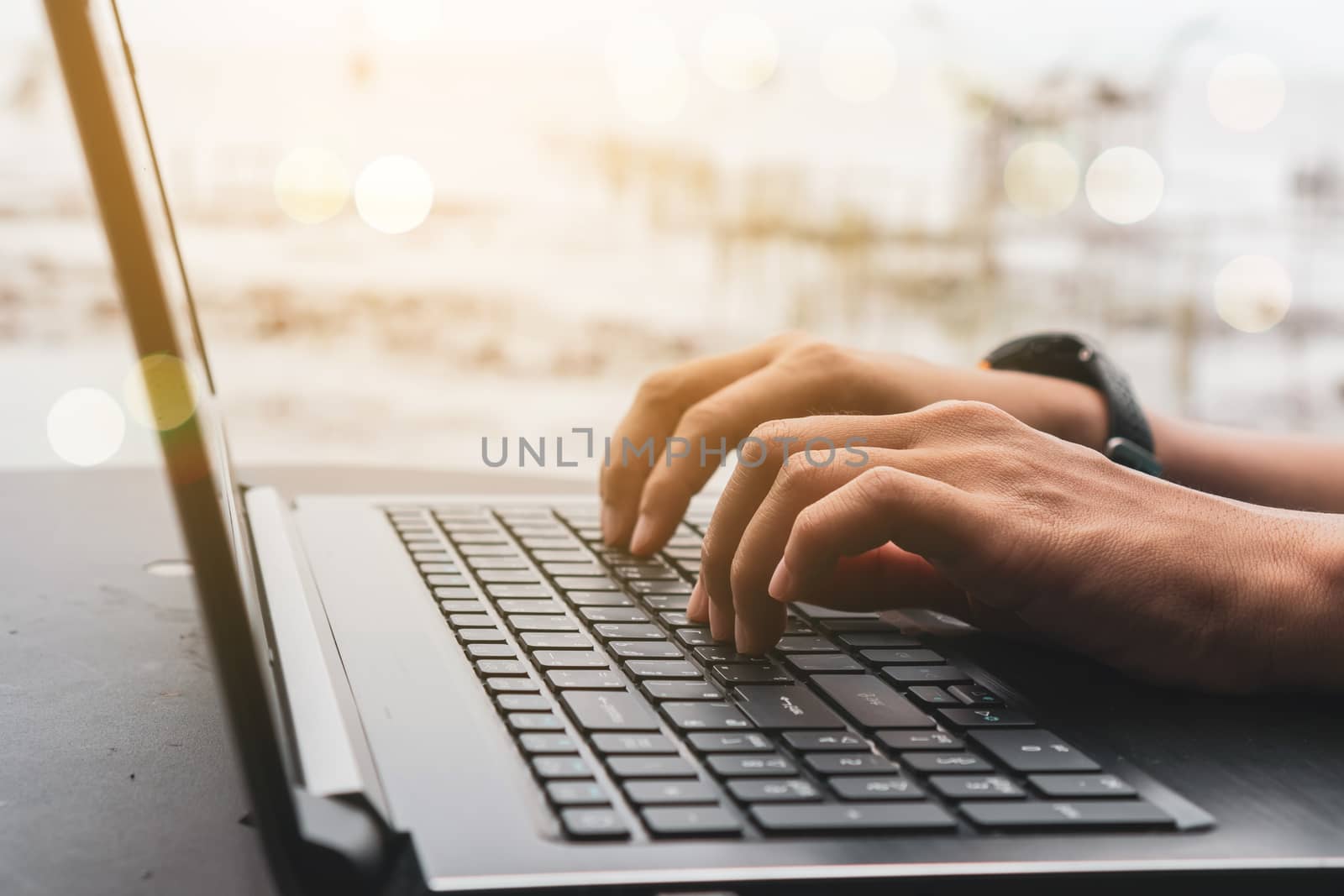 Woman hand using laptop to work study on work desk with clean nature background background. Business, financial, trade stock maket and social network concept.