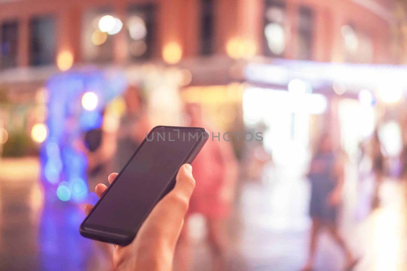 Woman hand use smartphone to do work business, social network, communication in public cafe work space area.