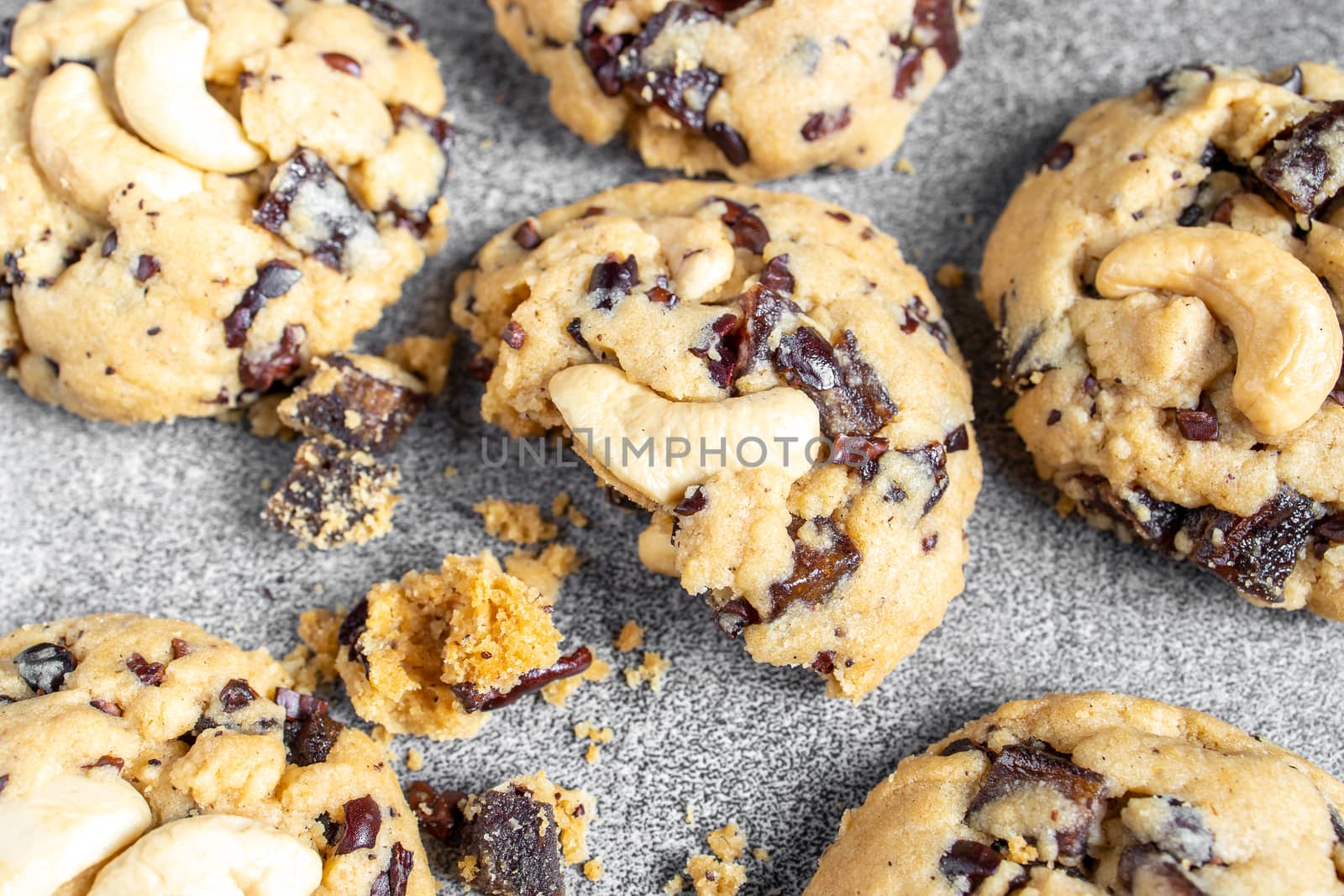 Stack of tasty chocolate cookies on gray table