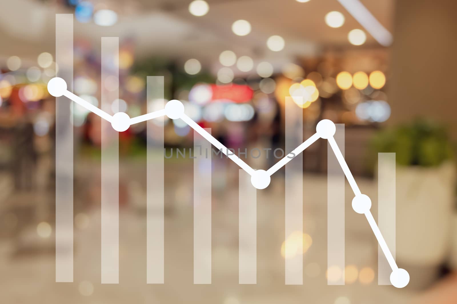 Down trend graph on blur mall department store background. by Suwant