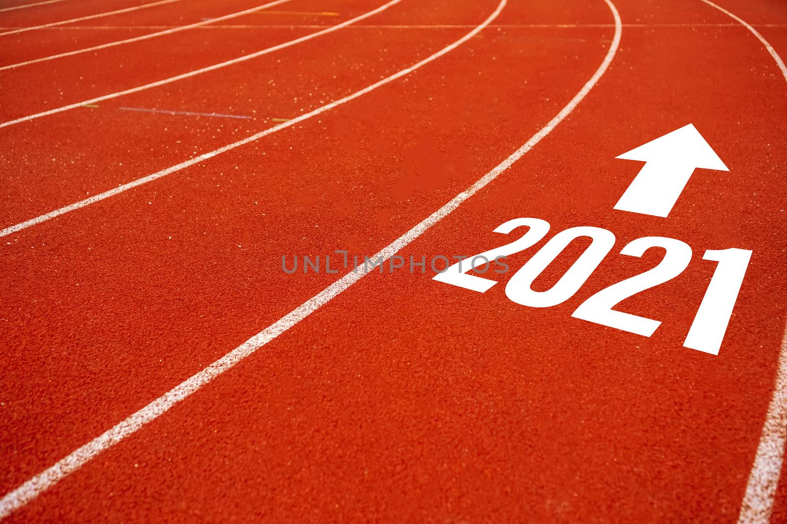 Start line to 2021 on running court represents the beginning of a journey to the destination in business planning, strategy and challenge or career path, opportunity concept.