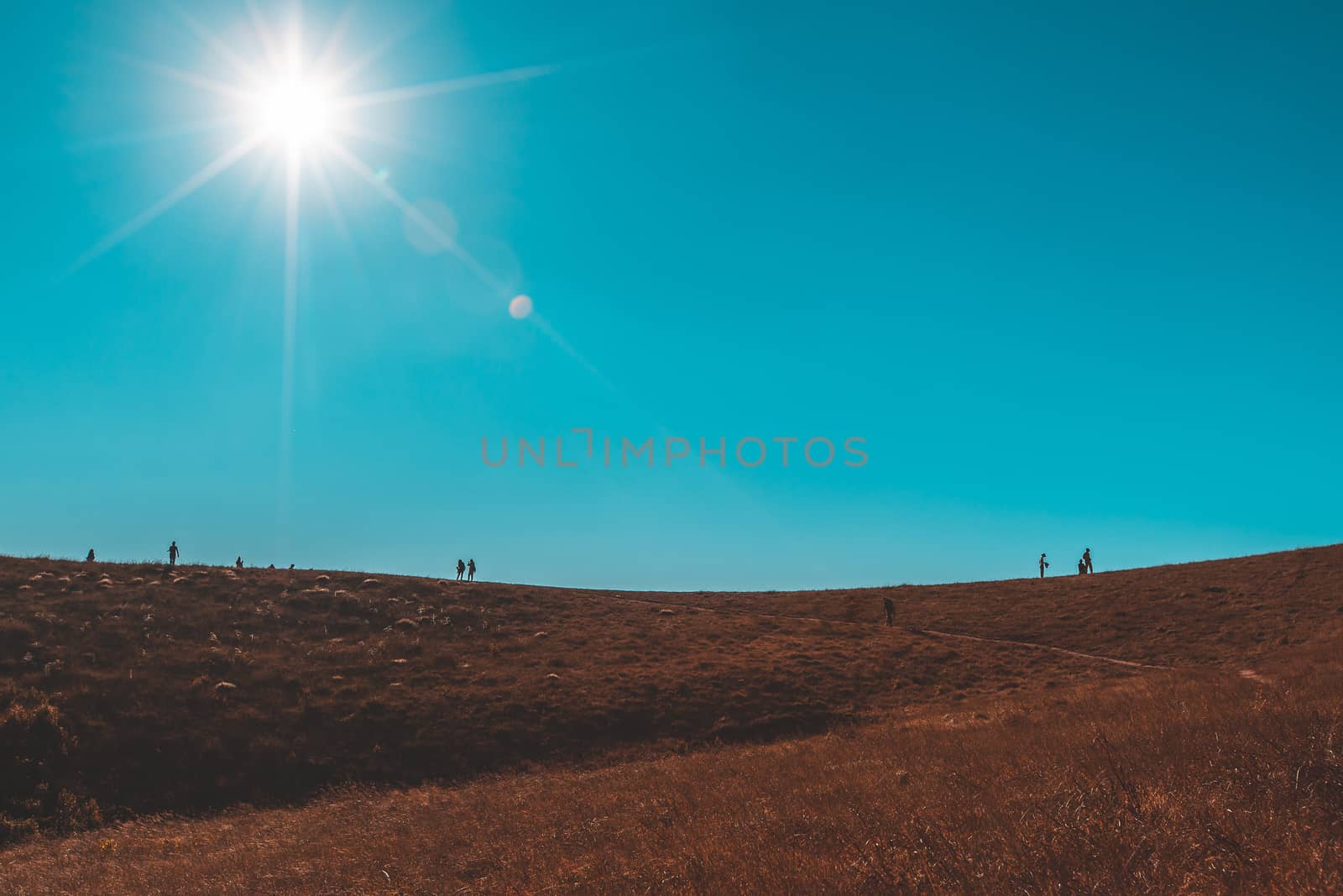 Silhouette of man hold up hands on the peak of mountain  by freedomnaruk