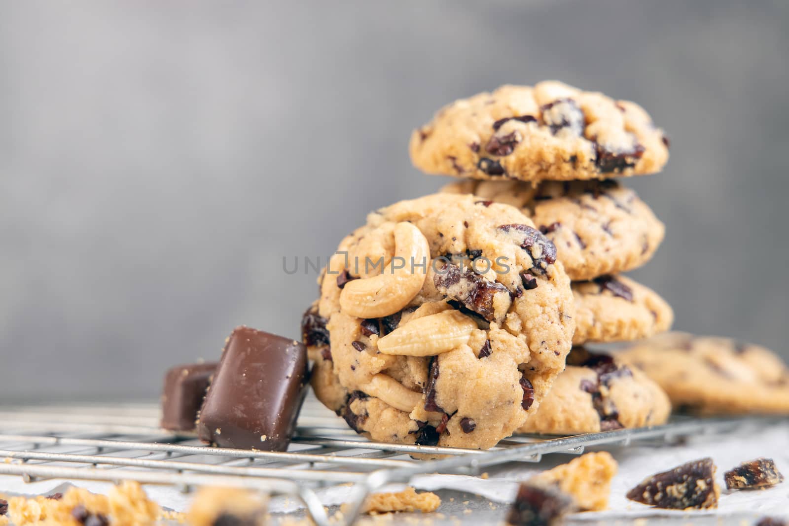 Stack of tasty chocolate cookies on gray table by freedomnaruk