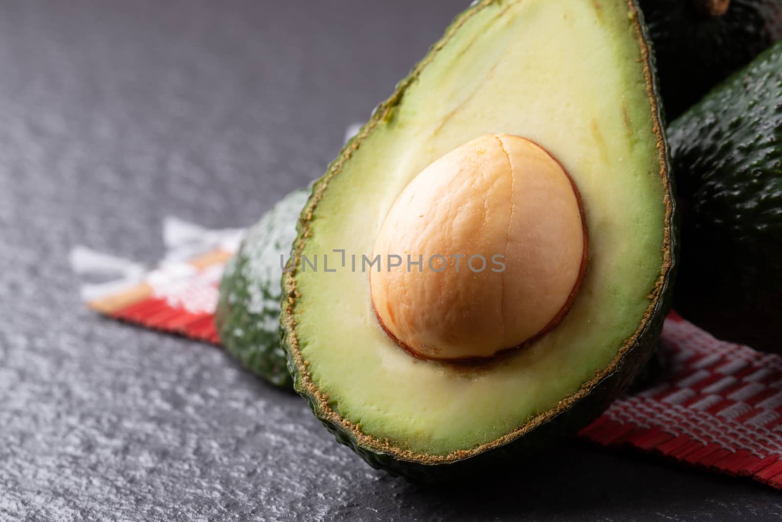 Avocado on old wooden table.