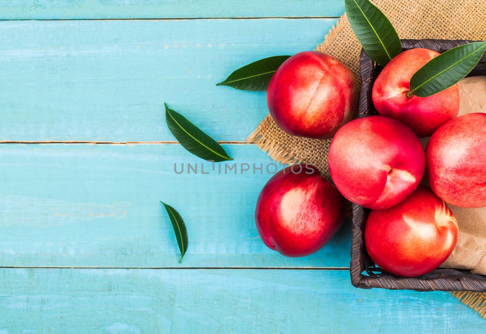 Sweet nectarine on wooden background