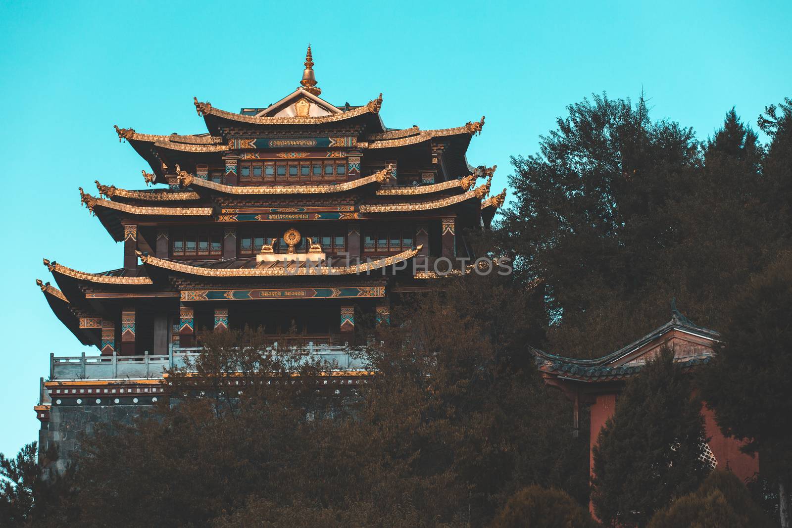 Guishan temple with giant buddhist tibetan prayer golden wheel in old town Shangri la