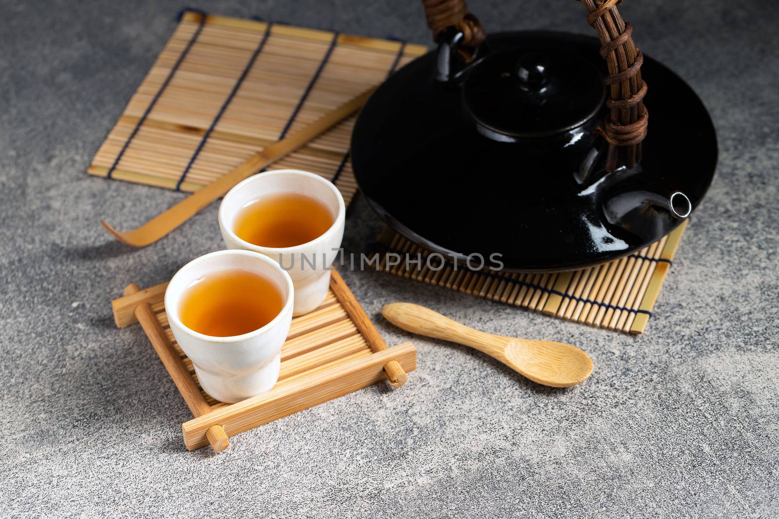 Hot tea in glass teapot and cup with steam by freedomnaruk