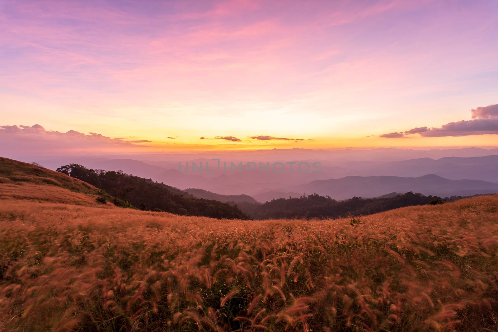 colorful dramatic sky with cloud at sunset  in the mountains