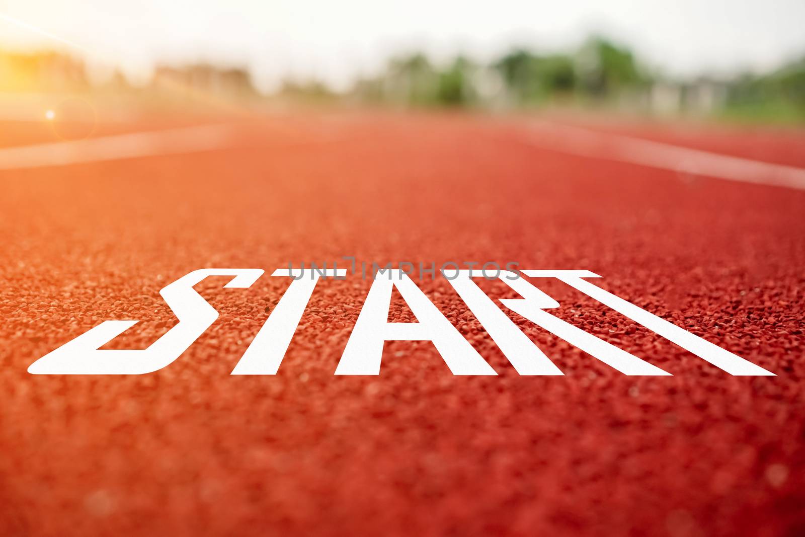 Start line on running court represents the beginning of a journey to the destination in business planning, strategy and challenge or career path, opportunity concept.