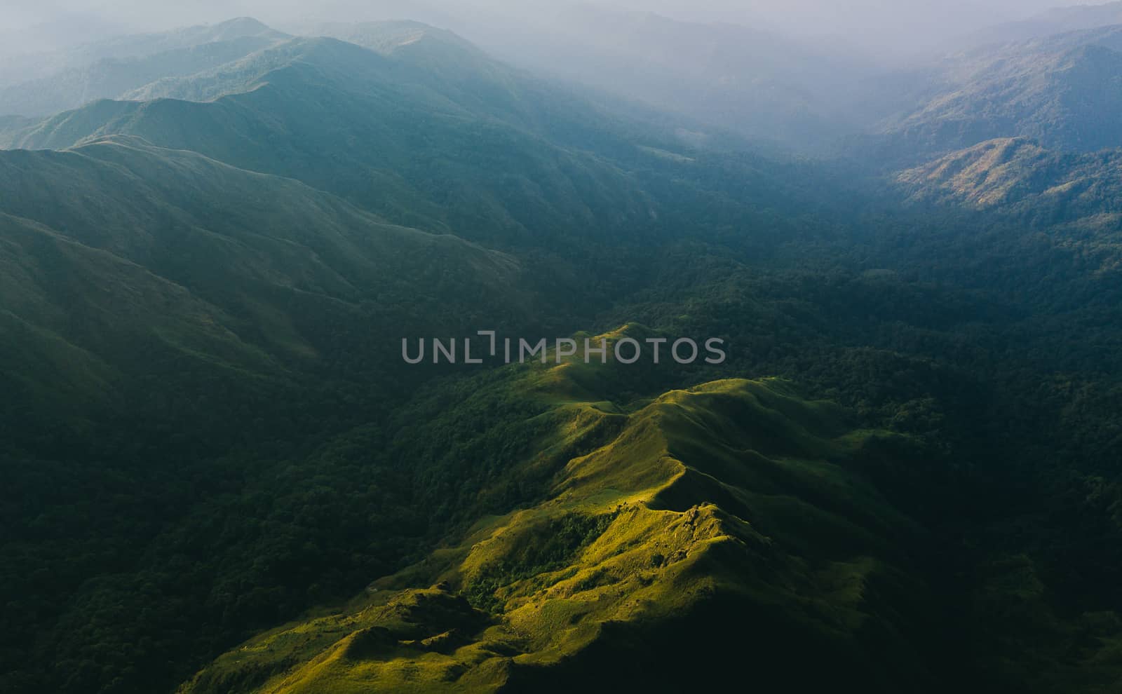 Top View Mulayit Taung golden light of the morning sun and the mist covered on Mount Mulayit,Myanmar