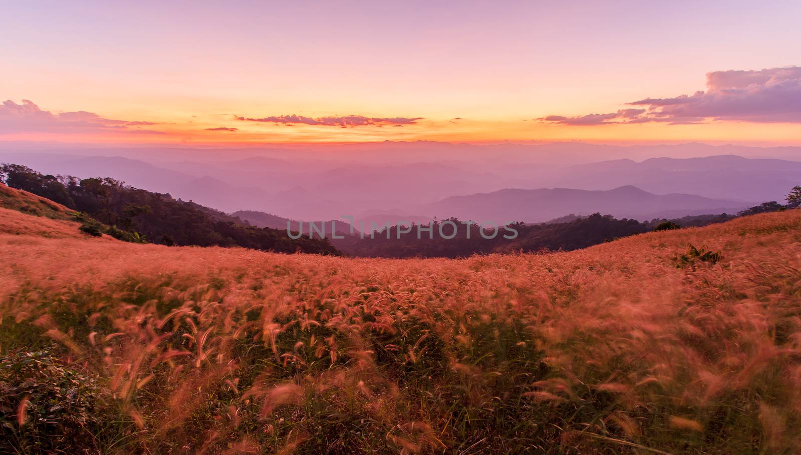 colorful dramatic sky with cloud at sunset in the mountains