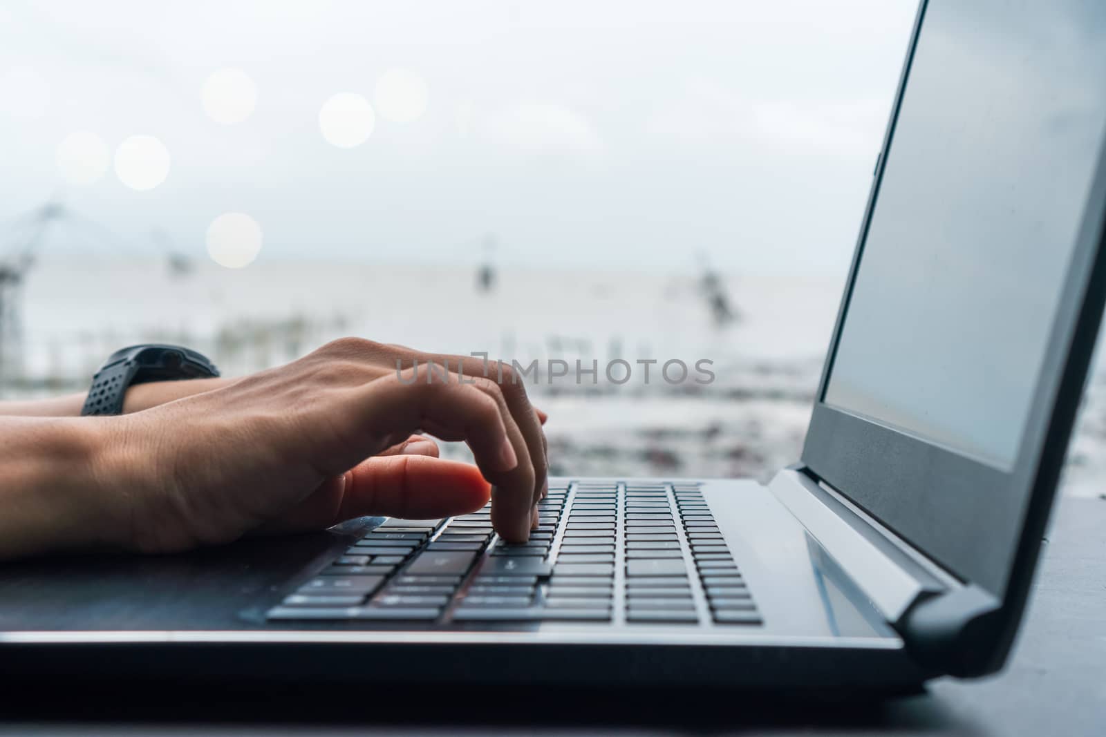 Woman hand using laptop to work study on work desk with clean nature background background. Business, financial, trade stock maket and social network. by Suwant