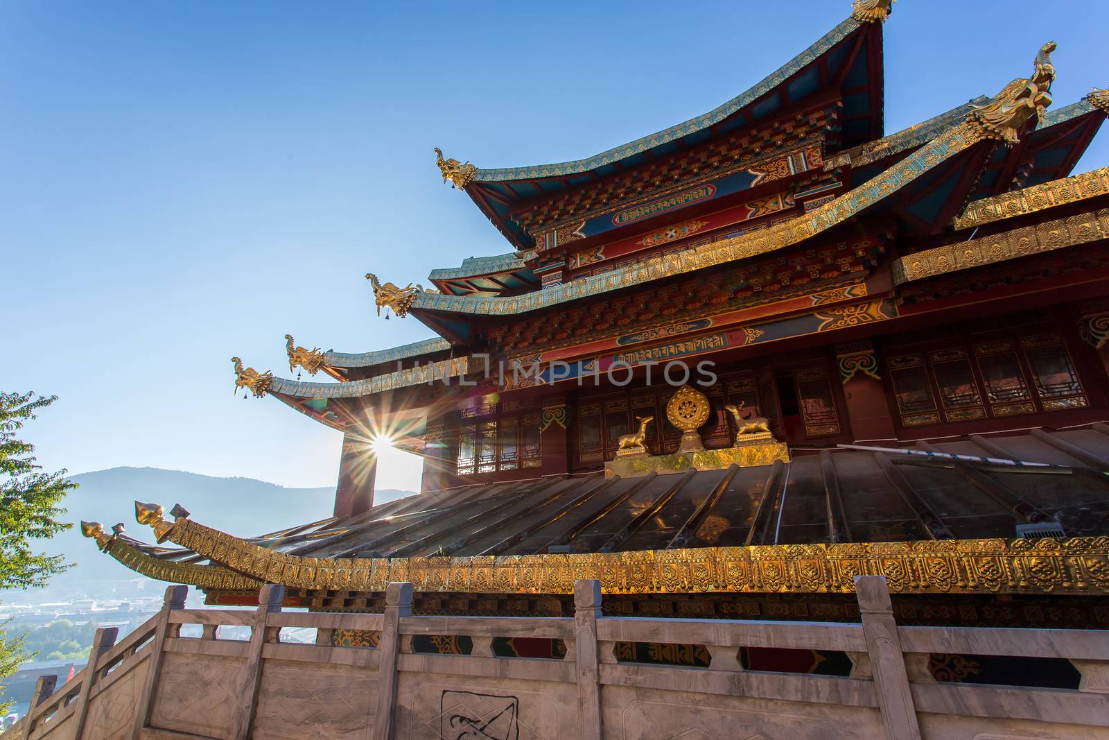 Guishan temple with giant buddhist tibetan prayer golden wheel in old town Shangri la