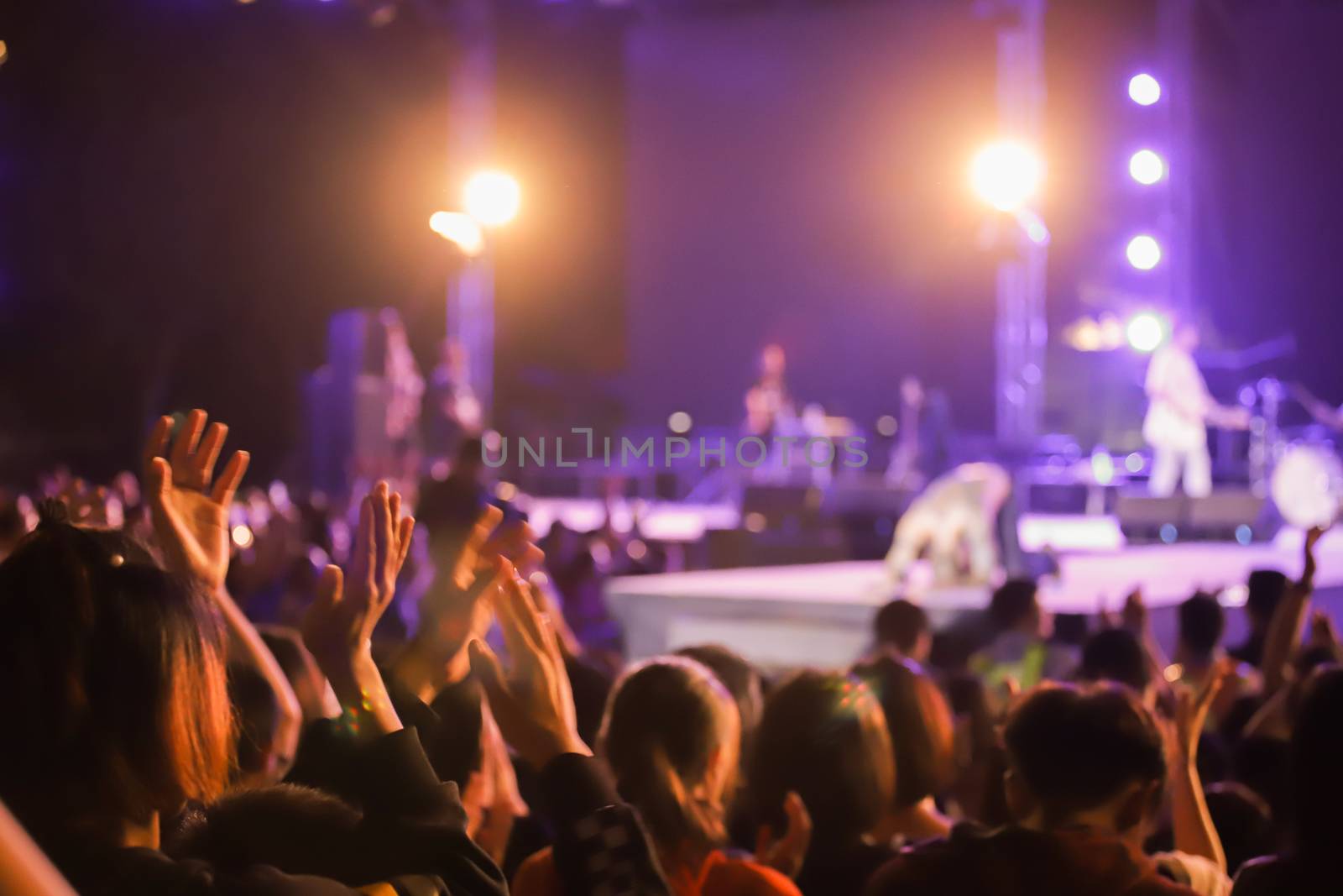 Defocused Abstract Live concert with raising hands. Silhouettes  by freedomnaruk