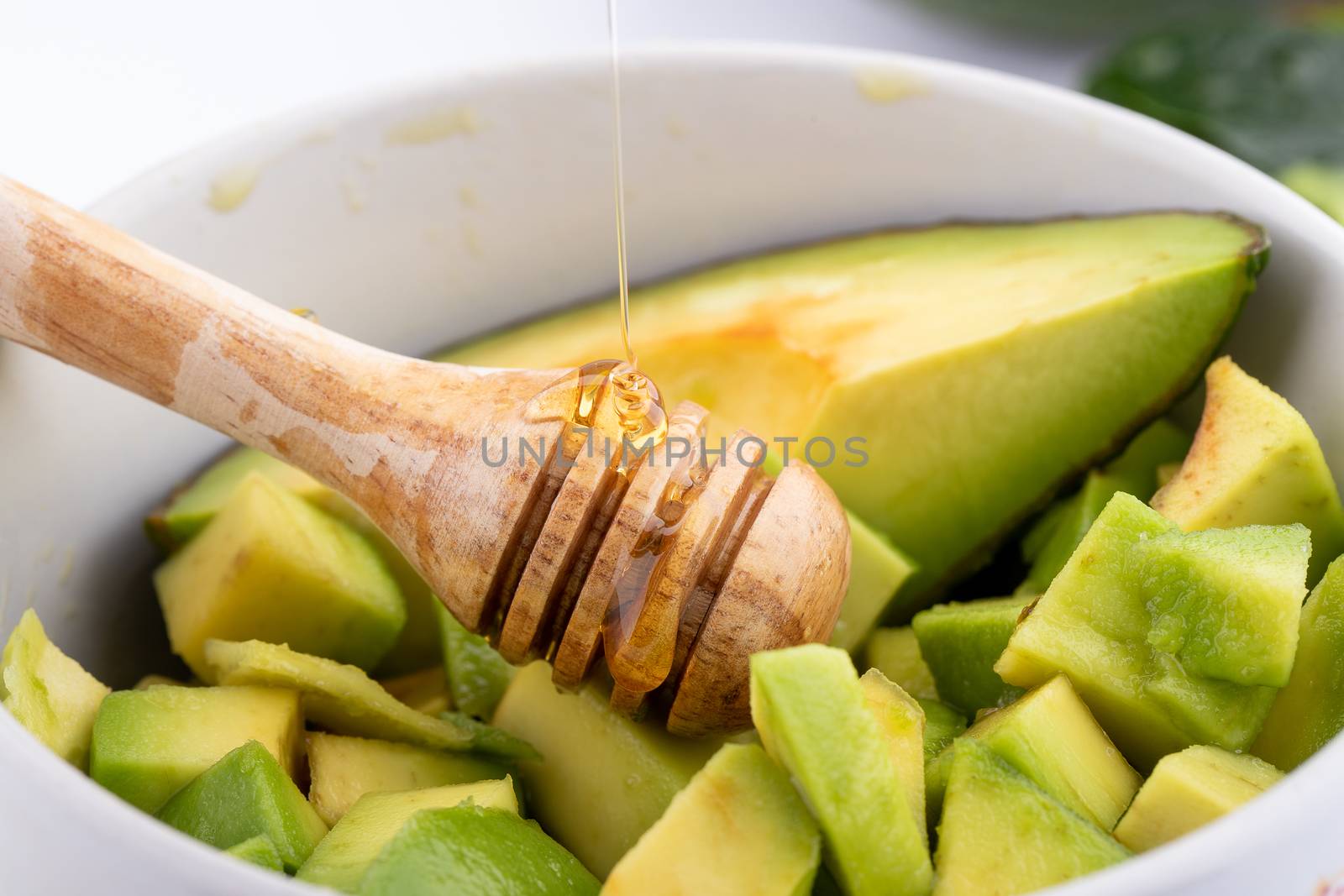 Avocado on old wooden table. by freedomnaruk